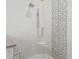 Modern shower with frameless glass enclosure and mosaic tile accents at 3503 E Princeton Ct, Gilbert, AZ 85234