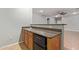 Wet bar with granite countertop, sink, and mini-fridge at 3503 E Princeton Ct, Gilbert, AZ 85234