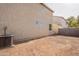 House exterior and AC unit shown in this backyard view at 402 N 66Th Ln, Phoenix, AZ 85043