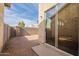 Small backyard with gravel and block wall. Sliding glass door access from inside at 402 N 66Th Ln, Phoenix, AZ 85043
