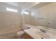 Clean bathroom with a tub, sink, and vanity at 402 N 66Th Ln, Phoenix, AZ 85043