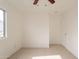 Well-lit bedroom with large window and ceiling fan at 402 N 66Th Ln, Phoenix, AZ 85043