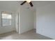 Bedroom with ceiling fan and window at 402 N 66Th Ln, Phoenix, AZ 85043