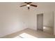Light and airy bedroom with mirrored closet and fan at 402 N 66Th Ln, Phoenix, AZ 85043