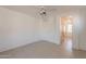 Bright bedroom with ceiling fan and tile flooring at 402 N 66Th Ln, Phoenix, AZ 85043