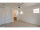 Bedroom with ceiling fan and access to bathroom at 402 N 66Th Ln, Phoenix, AZ 85043
