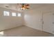 Simple bedroom with tiled floors and ceiling fan at 402 N 66Th Ln, Phoenix, AZ 85043