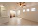 Dining area with tiled floors and sliding door at 402 N 66Th Ln, Phoenix, AZ 85043