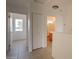 Upstairs hallway with tile flooring and linen closet at 402 N 66Th Ln, Phoenix, AZ 85043