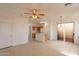 Kitchen with island and access to patio at 402 N 66Th Ln, Phoenix, AZ 85043