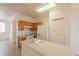 Bright kitchen with wood cabinets, white appliances, and an island at 402 N 66Th Ln, Phoenix, AZ 85043