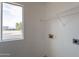 Laundry room with shelving and window at 402 N 66Th Ln, Phoenix, AZ 85043
