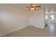 Living area with tiled floors and stairs at 402 N 66Th Ln, Phoenix, AZ 85043