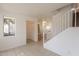 Bright living room with tiled floors and stairs at 402 N 66Th Ln, Phoenix, AZ 85043