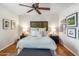 Bright bedroom with ceiling fan and hardwood floors at 4141 N 31St St # 215, Phoenix, AZ 85016