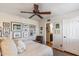 Bright bedroom with ceiling fan and lots of framed photos at 4141 N 31St St # 215, Phoenix, AZ 85016