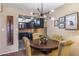 Charming dining area with wood table and four mustard yellow chairs at 4141 N 31St St # 215, Phoenix, AZ 85016