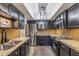 Modern kitchen with granite countertops and stainless steel appliances at 4141 N 31St St # 215, Phoenix, AZ 85016