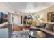 Spacious living room with sectional sofa, hardwood floors, and a view of the kitchen and dining area at 4141 N 31St St # 215, Phoenix, AZ 85016