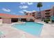 Community pool and spa with lounge chairs and patio tables at 4141 N 31St St # 215, Phoenix, AZ 85016