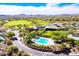 Community clubhouse with pool, tennis courts, and golf course views at 41717 N Moss Springs Ct, Anthem, AZ 85086