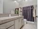 Clean bathroom with a vanity and shower/tub combo at 41717 N Moss Springs Ct, Anthem, AZ 85086