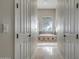 Bathroom with a large soaking tub, tiled floors and a window at 41717 N Moss Springs Ct, Anthem, AZ 85086