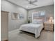 Bright bedroom with a queen-size bed and wicker furniture at 41717 N Moss Springs Ct, Anthem, AZ 85086