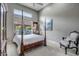 Spacious bedroom with a four-poster bed and sitting area at 41717 N Moss Springs Ct, Anthem, AZ 85086