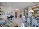 Elegant dining room featuring a grand piano and a formal dining table set at 41717 N Moss Springs Ct, Anthem, AZ 85086