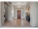 Spacious foyer with tiled floors and grand entry door at 41717 N Moss Springs Ct, Anthem, AZ 85086