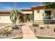 Luxury home with welcoming front entry and xeriscaped landscaping at 41717 N Moss Springs Ct, Anthem, AZ 85086