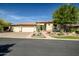Beautiful home with three car garage and desert landscaping at 41717 N Moss Springs Ct, Anthem, AZ 85086