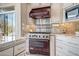 Modern kitchen features a professional range and stylish cabinetry at 41717 N Moss Springs Ct, Anthem, AZ 85086