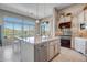 Island kitchen with granite countertops, stainless steel appliances, and breakfast bar at 41717 N Moss Springs Ct, Anthem, AZ 85086