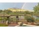 Enjoy a rainbow and mountain views from your patio at 41717 N Moss Springs Ct, Anthem, AZ 85086