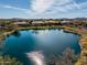 Picturesque pond reflecting homes and lush vegetation at 41717 N Moss Springs Ct, Anthem, AZ 85086