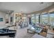 Elegant living room with expansive windows and lake views at 41717 N Moss Springs Ct, Anthem, AZ 85086