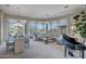 Open floor plan living and dining area with lake views at 41717 N Moss Springs Ct, Anthem, AZ 85086