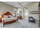 Spacious main bedroom with a large bed, ensuite bathroom, and ample natural light at 41717 N Moss Springs Ct, Anthem, AZ 85086
