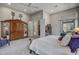 Bright main bedroom with a king-size bed and access to a private patio at 41717 N Moss Springs Ct, Anthem, AZ 85086