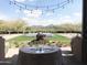 Romantic outdoor patio setting with mountain views at 41717 N Moss Springs Ct, Anthem, AZ 85086
