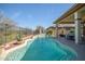 Resort style pool and patio with seating and dining at 41717 N Moss Springs Ct, Anthem, AZ 85086