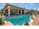 Large freeform pool with spacious patio and fountain at 41717 N Moss Springs Ct, Anthem, AZ 85086