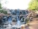 Landscaped waterfall feature in a park-like setting at 41717 N Moss Springs Ct, Anthem, AZ 85086