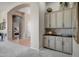 Built-in wet bar with ample cabinetry and a countertop perfect for entertaining at 41717 N Moss Springs Ct, Anthem, AZ 85086