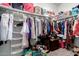 Spacious closet featuring multiple shelves, hanging racks, and ample storage space at 41917 W Manderas Ln, Maricopa, AZ 85138