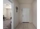 Inviting entryway with a neutral color palette and tile flooring at 41917 W Manderas Ln, Maricopa, AZ 85138