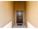 A close up of a front door that is framed by an exterior wall at 41917 W Manderas Ln, Maricopa, AZ 85138