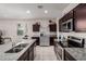 Kitchen with granite countertops, stainless appliances and ample cabinet space at 41917 W Manderas Ln, Maricopa, AZ 85138